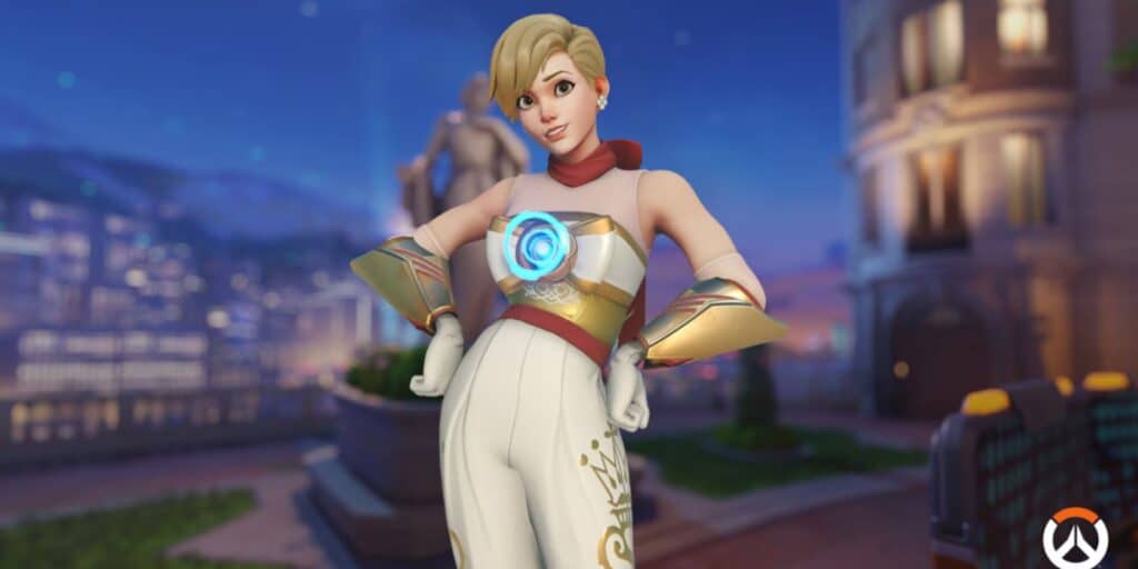 Tracer stands confidently in a stylish outfit with a glowing chest emblem, set against a vibrant city backdrop