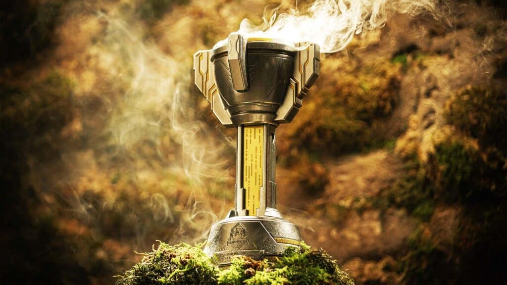 Image of HCS trophy surrounded by foliage illuminated by light fro above