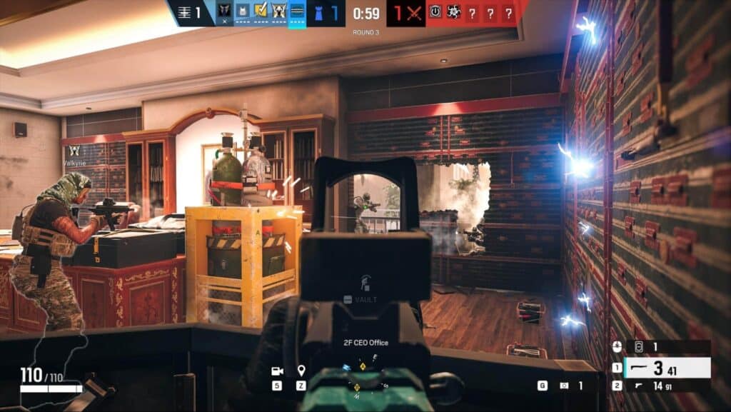 Players defend an objective inside a fortified room during a Rainbow Six Siege X match